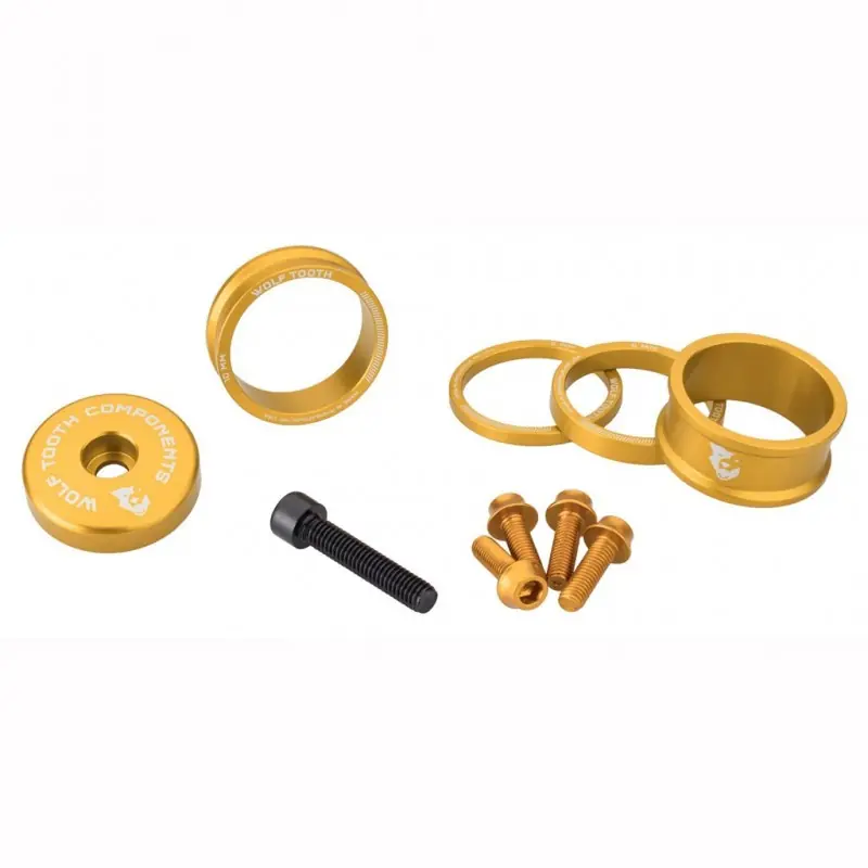 Kit espaciador. Tapa de la potencia y tornillos WOLFTOOTH BLING KIT Oro