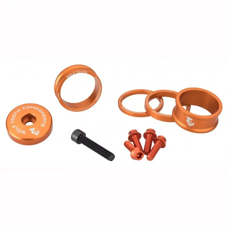 Kit Espaciador. Tapa de la potencia y tornillos KIT WOLFTOOTH BLING Naranja